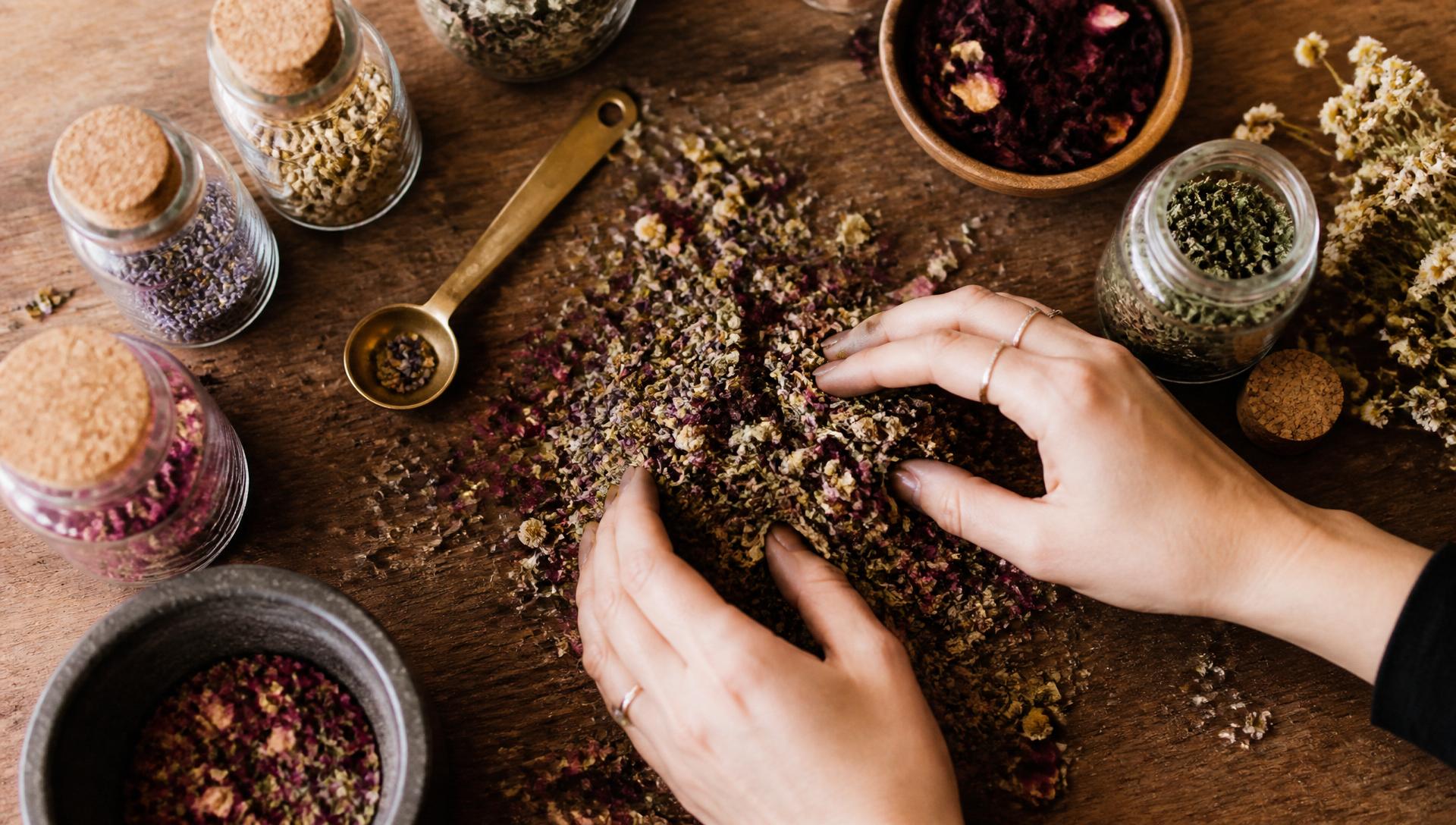Dried herbs and botanicals laid out for tea blending